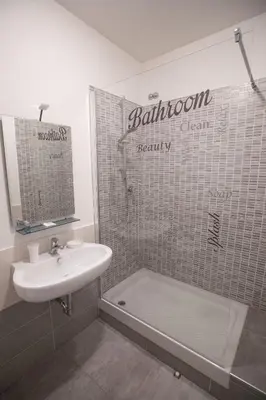a bathroom with a sink and a toilet and a shower at B&B Momenti Romani in Rome