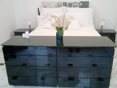 a bedroom with a bed and a dresser with a bed at The Pope At The Window in Rome