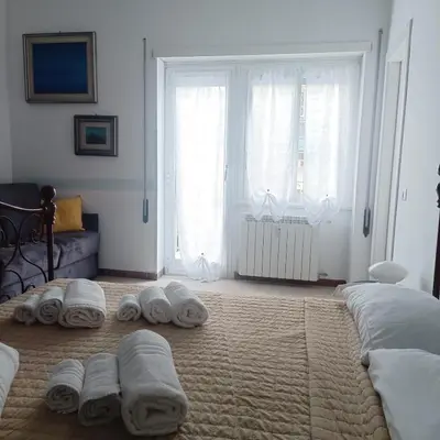 a bedroom with towels laying on the floor at The Pope At The Window in Rome
