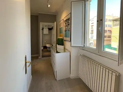 a hallway with a room with a window at Vatican Holiday Apartment 317 in Rome