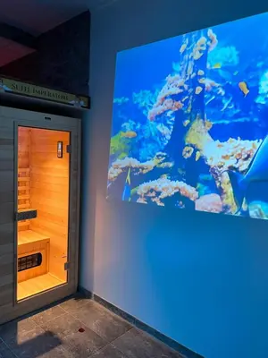 a room with an aquarium with a large screen at Imperatore in Rome