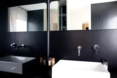 a bathroom with a sink and a mirror at Sora Luxury Inn in Rome