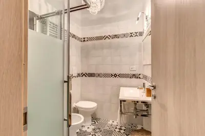 a small bathroom with a toilet and a sink at Loft in San Pietro in Rome