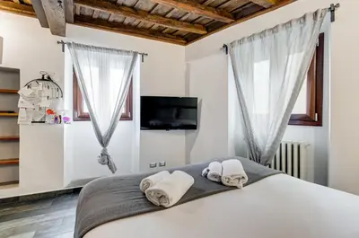 a bedroom with a bed with towels on it at Chiavari Apartment in Rome