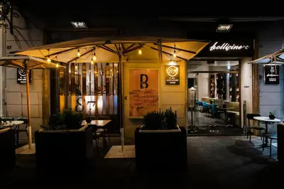 a restaurant with tables and chairs and an umbrella at Hotel 87 eighty-seven - Maison d'Art Collection in Rome
