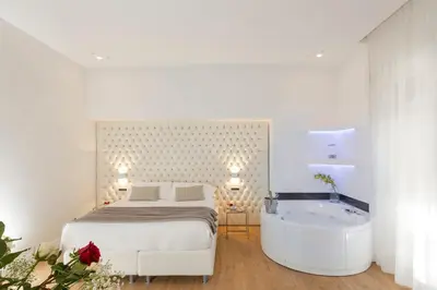 a bedroom with a bed and a bath tub at Vatican Style in Rome