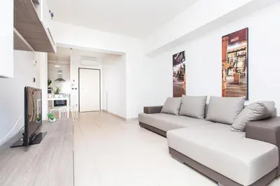 a living room with a couch and a tv at Boutique Domus in Rome