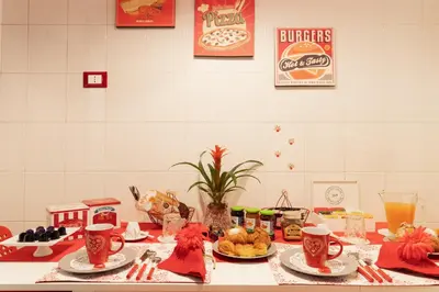 a table with food and drinks on top of it at B&B La Maison de Jo in Rome