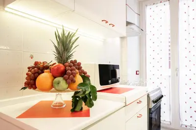 a bowl of fruit on a counter in a kitchen at B&B La Maison de Jo in Rome