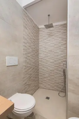 a bathroom with a toilet and a shower at Vaticanspace Rooms in Rome