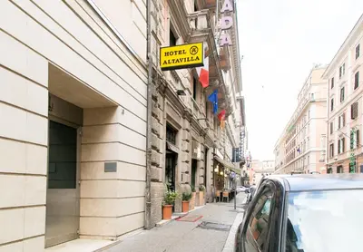a sign on the side of a building on a street at Hotel Altavilla 9 in Rome