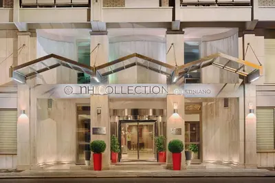 a building with the entrance to the mola collections entrance at NH Collection Roma Giustiniano in Rome