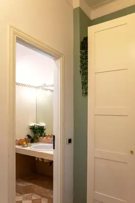 a bathroom with a sink and a mirror at B&B A Casa di Tiziana - Roma in Rome