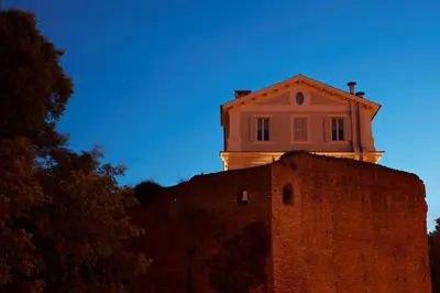 a building on top of a brick wall at Hotel The Building in Rome