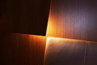 a wooden wall with a light on it at Hotel The Building in Rome
