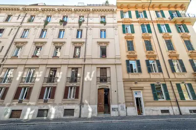 a large building with many windows on a street at Lea Luxury Rooms in Rome