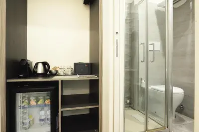a bathroom with a shower stall and a toilet at Room with a view 105 in Rome