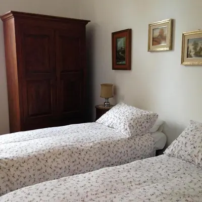 two beds sitting next to each other in a bedroom at Casa in Trastevere in Rome