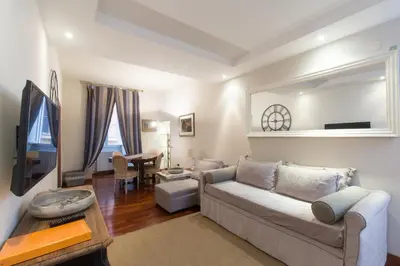 a living room with a couch and a table at Holidays Banchi Nuovi in Rome