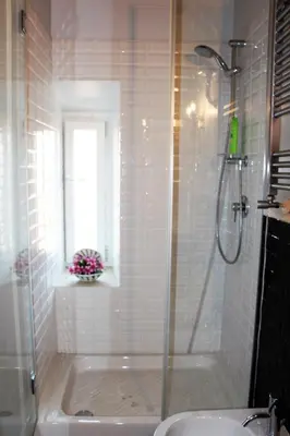 a bathroom with a shower and a tub and a sink at La Rosa del Vaticano Luxury Apartment in Rome