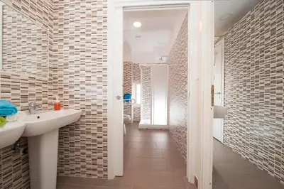 a bathroom with a sink and a mirror at Budget Rooms Des Arts in Rome