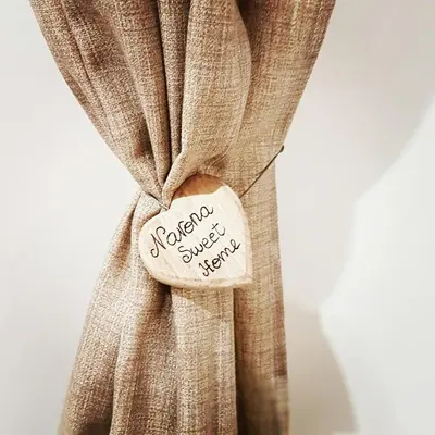 a tag on a curtain with the words revision surgery kept at Navona Sweet Home in Rome