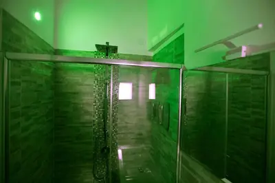 a bathroom with a shower with a glass door at Navona Sweet Home in Rome
