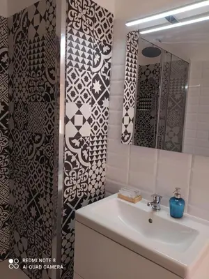 a bathroom with a sink and a mirror at Flaminio Holidays in Rome
