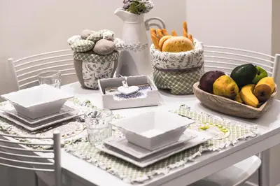 a table with plates and bowls of fruits and vegetables at Madonna dei Monti in Rome