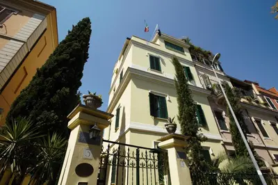 a building with a fence in front of it at Residenza Matilde in Rome