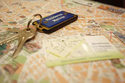 a pair of keys sitting on top of a map at Residenza Matilde in Rome