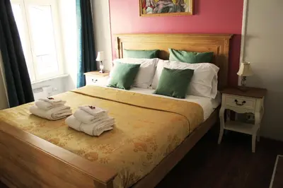 a bedroom with a bed with towels on it at Raphael Rooms in Rome