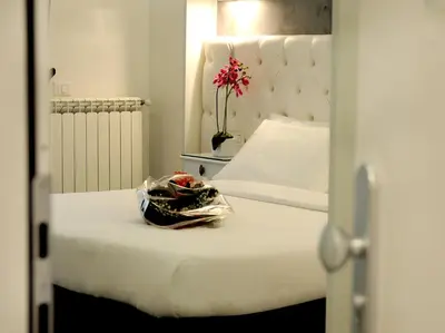 a bed with a plastic bag on top of it at Easyrome Guest House in Rome