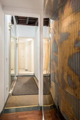 a hallway with a wall with a painting on it at Dell'Orso Residence in Rome