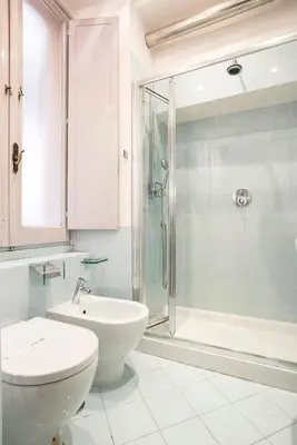 a bathroom with a shower and a toilet and a sink at Dell'Orso Residence in Rome