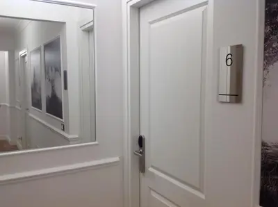 a door with a mirror in a room at Vatican Luxury Home in Rome
