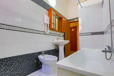 a bathroom with a sink and a toilet at Gordon's Apartment in Rome
