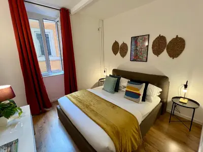 a bedroom with a bed and a window at Charming Navona in Rome