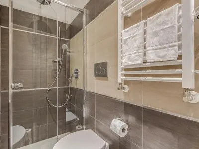 a bathroom with a toilet and a shower at Penta Luxury House in Rome