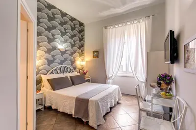 a hotel room with a bed and a window at La Casa Di Amy in Rome