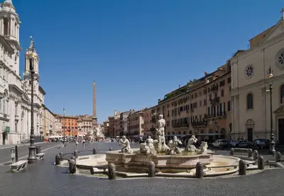 a fountain in the middle of a city street at Ciao Bella Stella in Rome