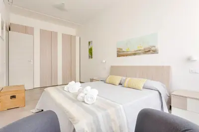a bedroom with a bed with towels on it at Franca's Home in Rome