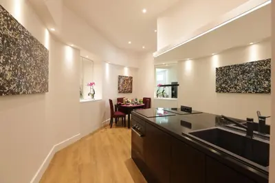 a kitchen with a sink and a counter top at Sant'Angelo Exclusive Spacious Art in Rome