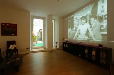 a living room with a large screen in the wall at Sant'Angelo Exclusive Spacious Art in Rome