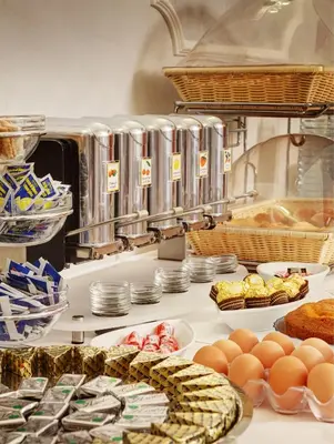 a kitchen with eggs and other food on a counter at Hotel Best Roma in Rome
