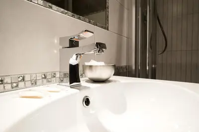 a bathroom sink with a faucet on top of it at AS Planet in Rome
