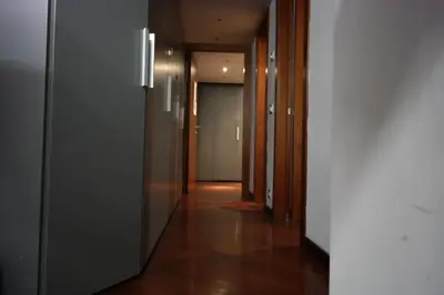 a hallway with many doors and a hallway at Happy Rome in Rome