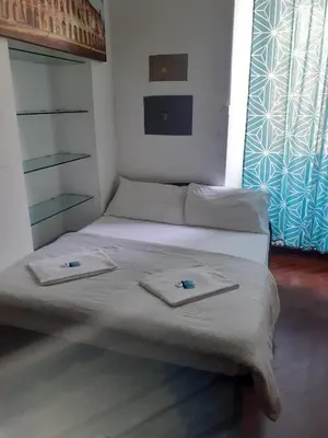 a bedroom with a bed with two towels on it at Happy Rome in Rome