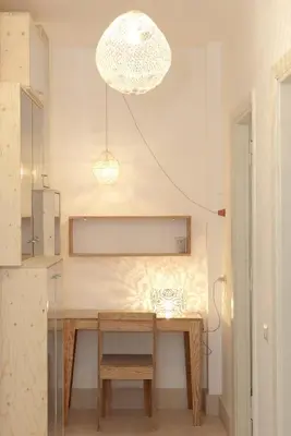 a dining room with a wooden table and a chandelier at Testaccio Old Rome Apartment in Rome
