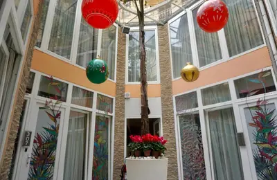 a building with red and green lanterns hanging from the ceiling at Hotel Vespasiano in Rome